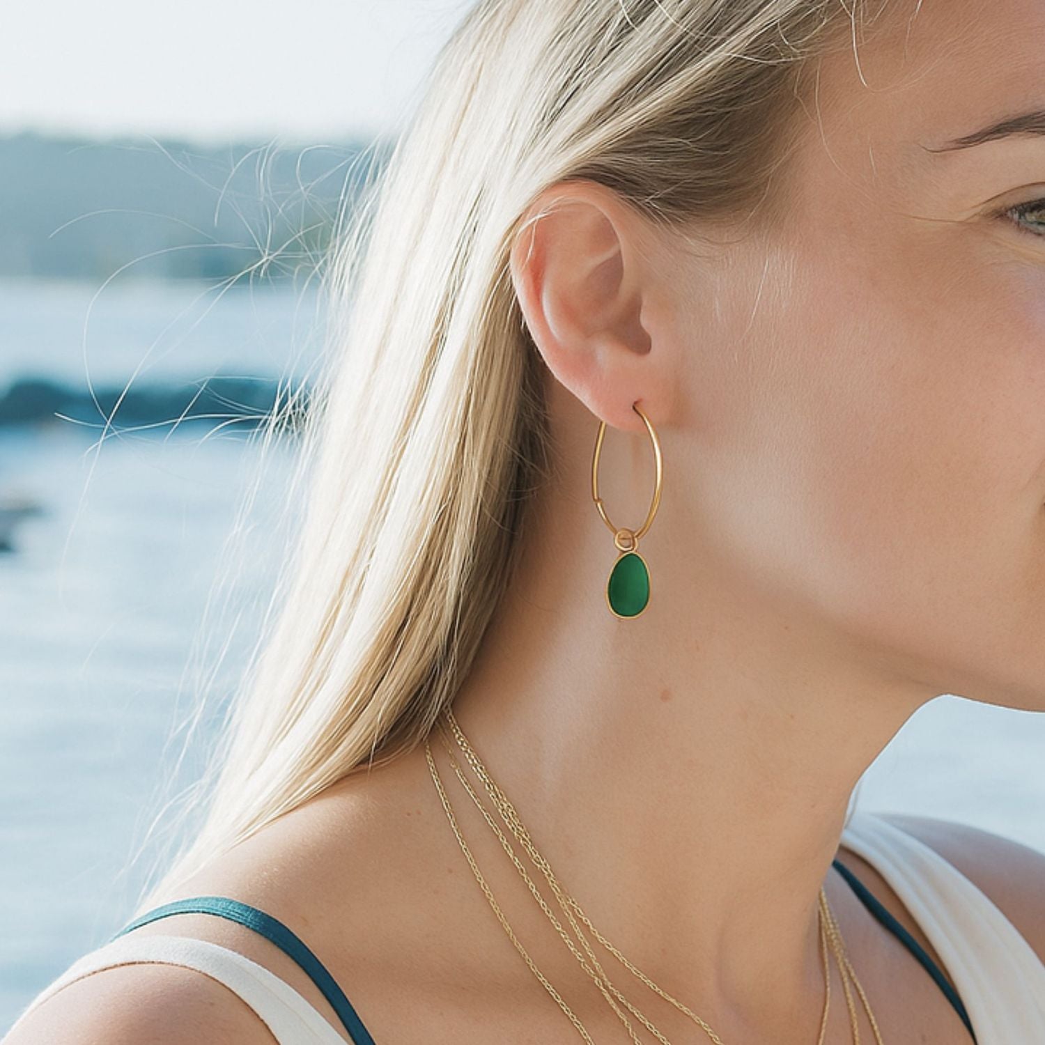 Gold hoop earrings with removable green sea glass charms