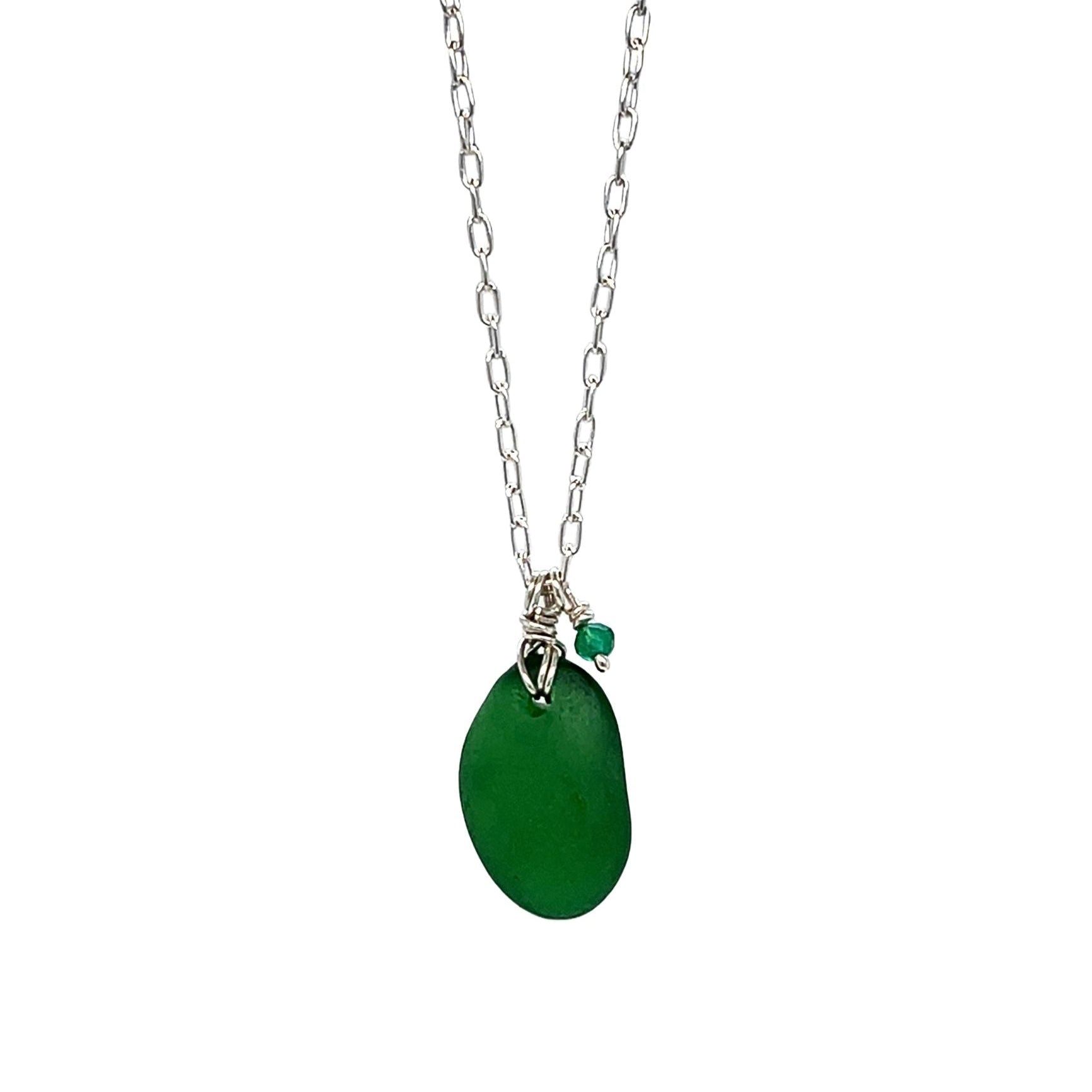 Close-up of green sea glass pendant and sterling silver chain