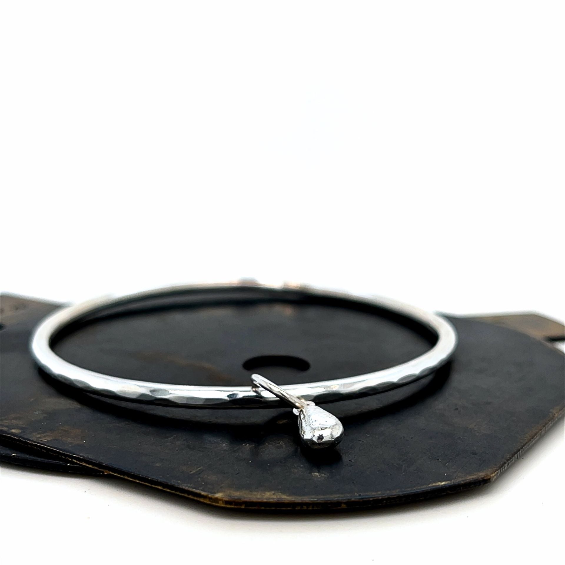 hammered silver bangle and charm
