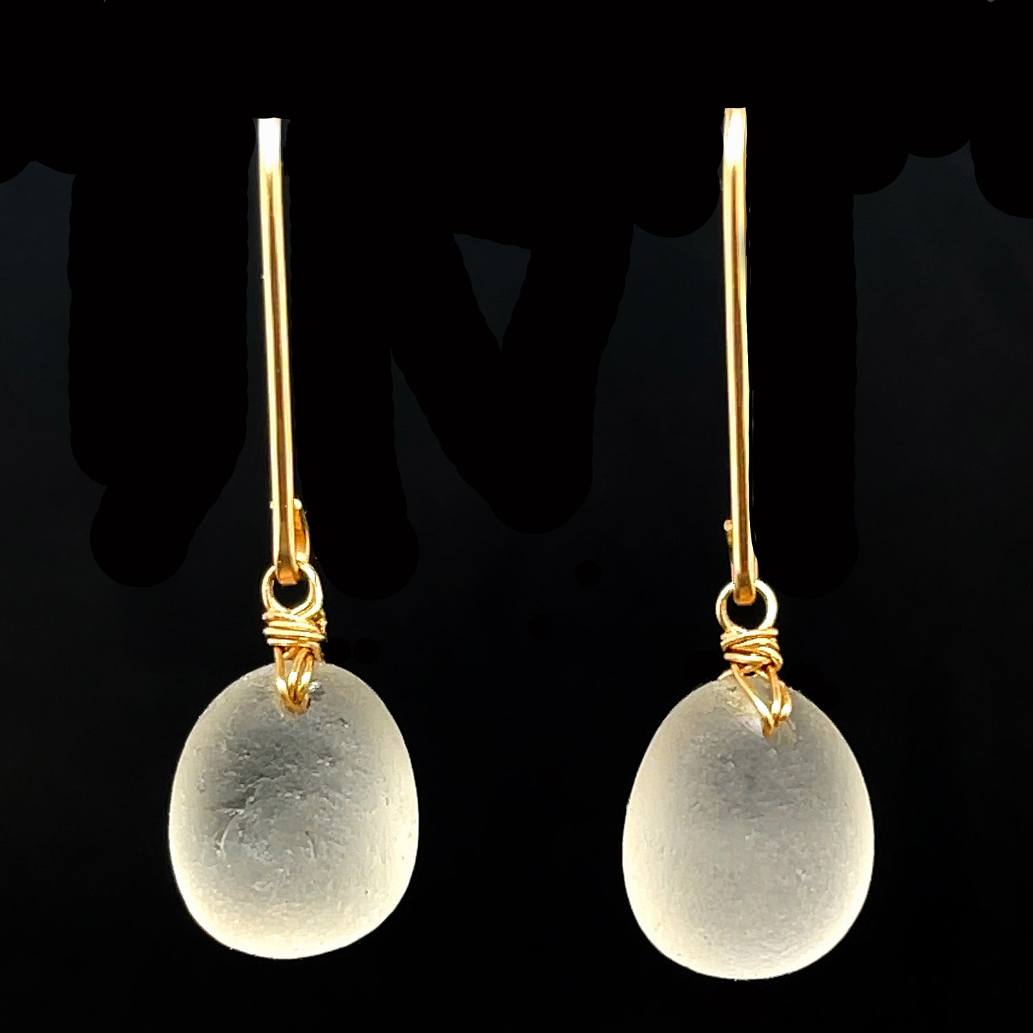 Unique Clear Sea Glass Earrings featuring natural textures and gold accents, perfect for any occasion