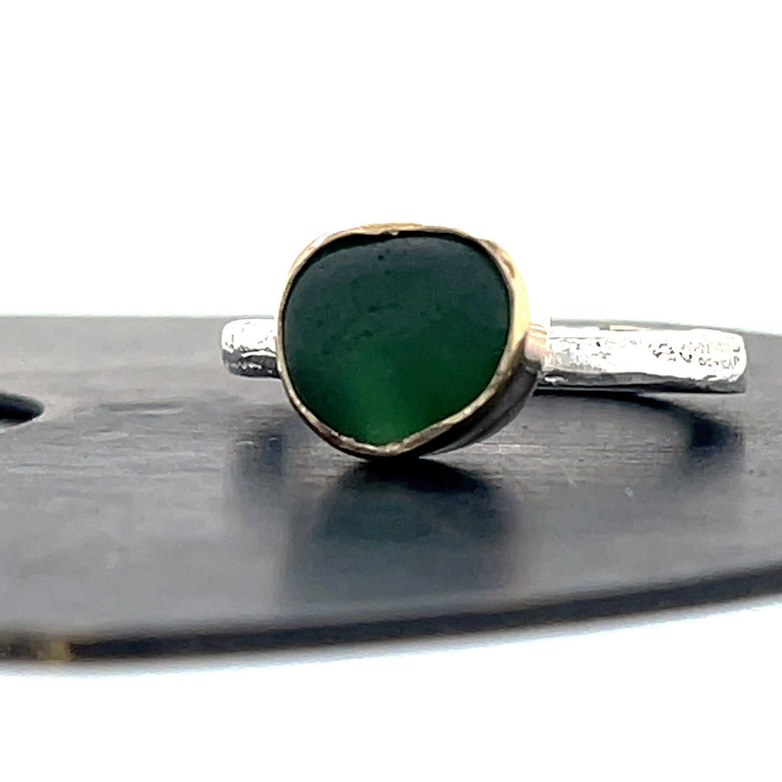 green seaglass set in gold bezelsilver ring