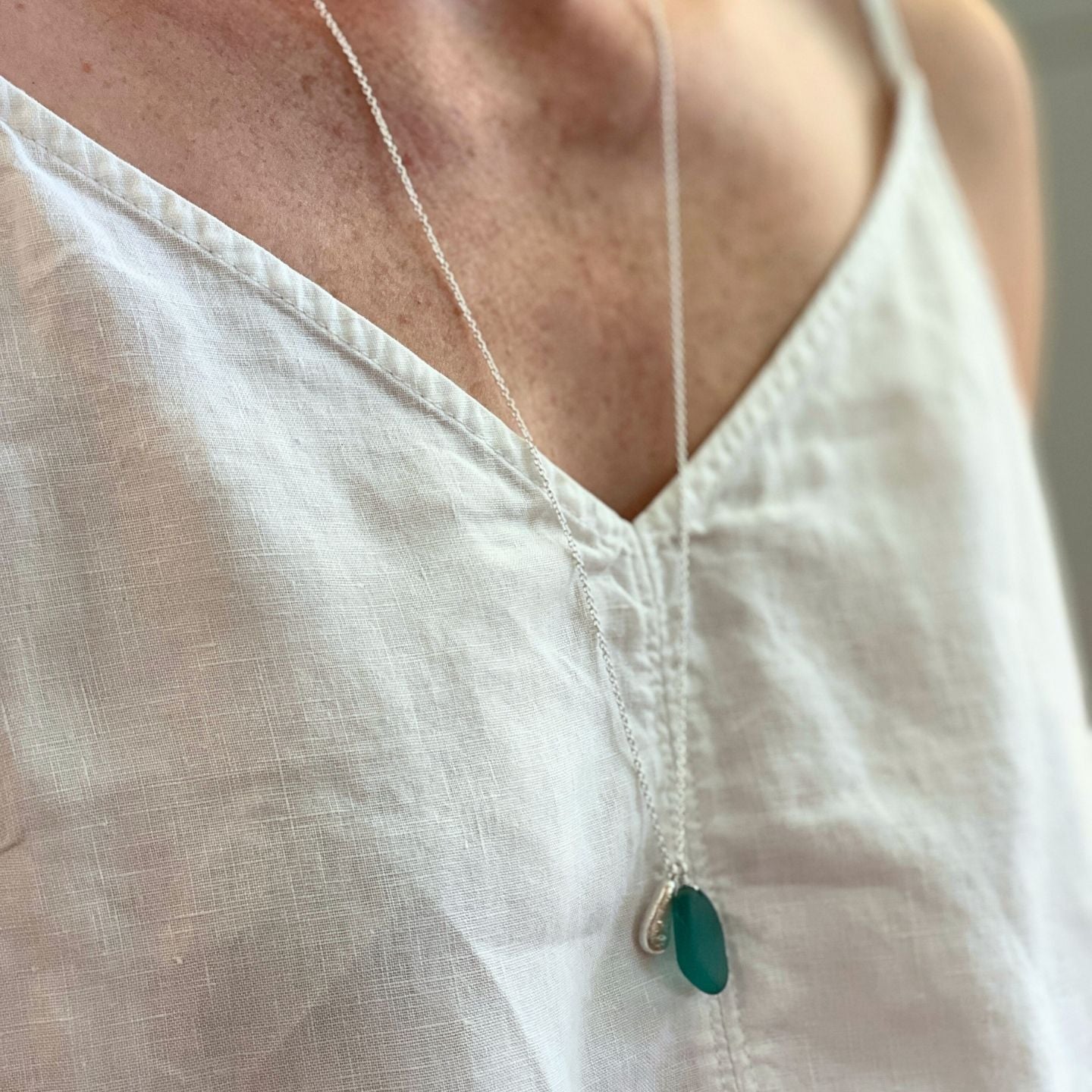 Handcrafted teal sea glass necklace on sterling silver cable chain