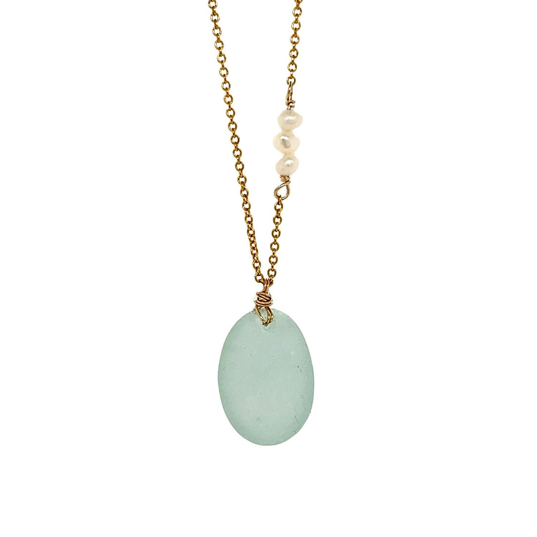 Seafoam sea glass necklace on a fine gold-filled chain with a freshwater pearl detail, handmade coastal jewellery.
