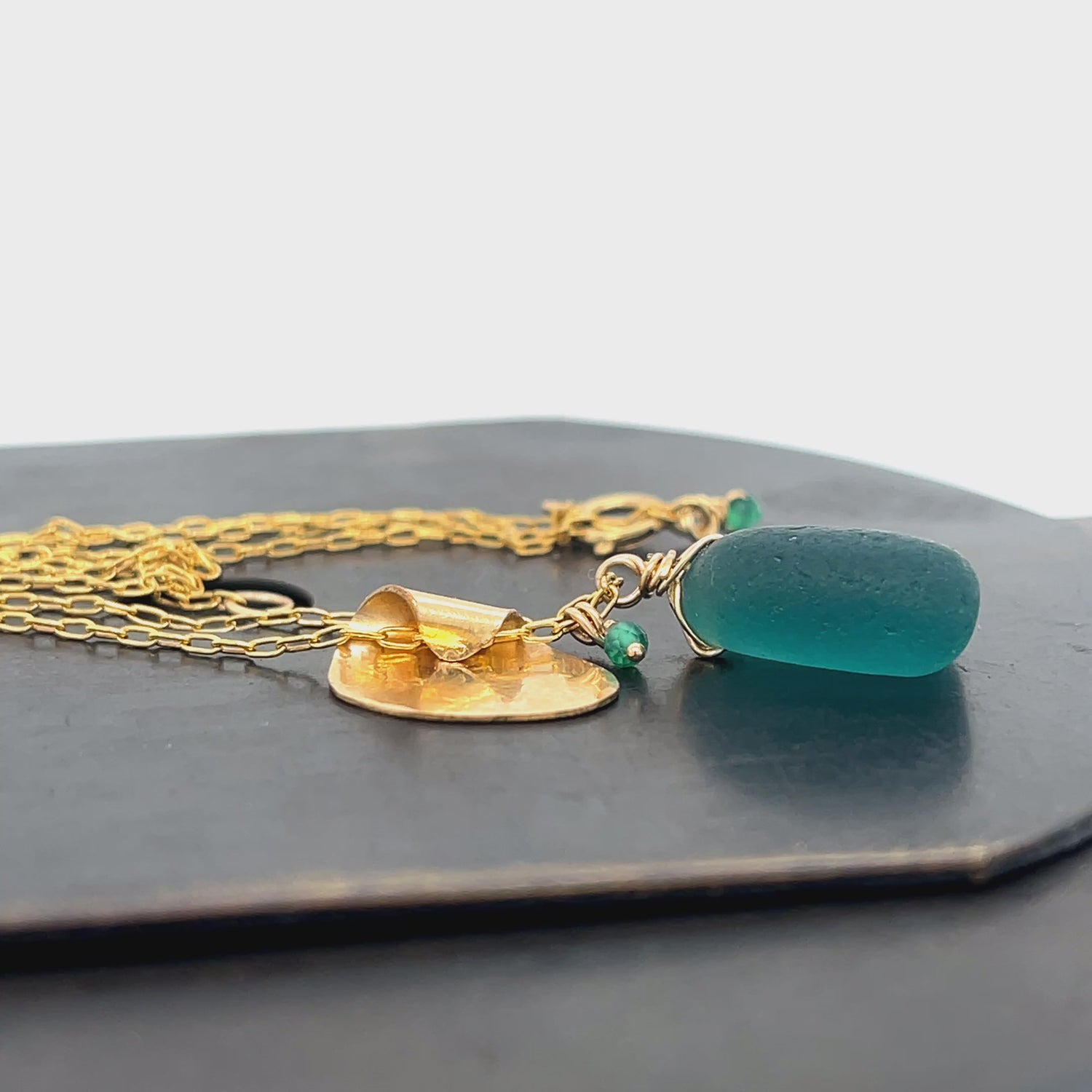 Coastal-inspired gold leaf and sea glass necklace by Kriket Broadhurst