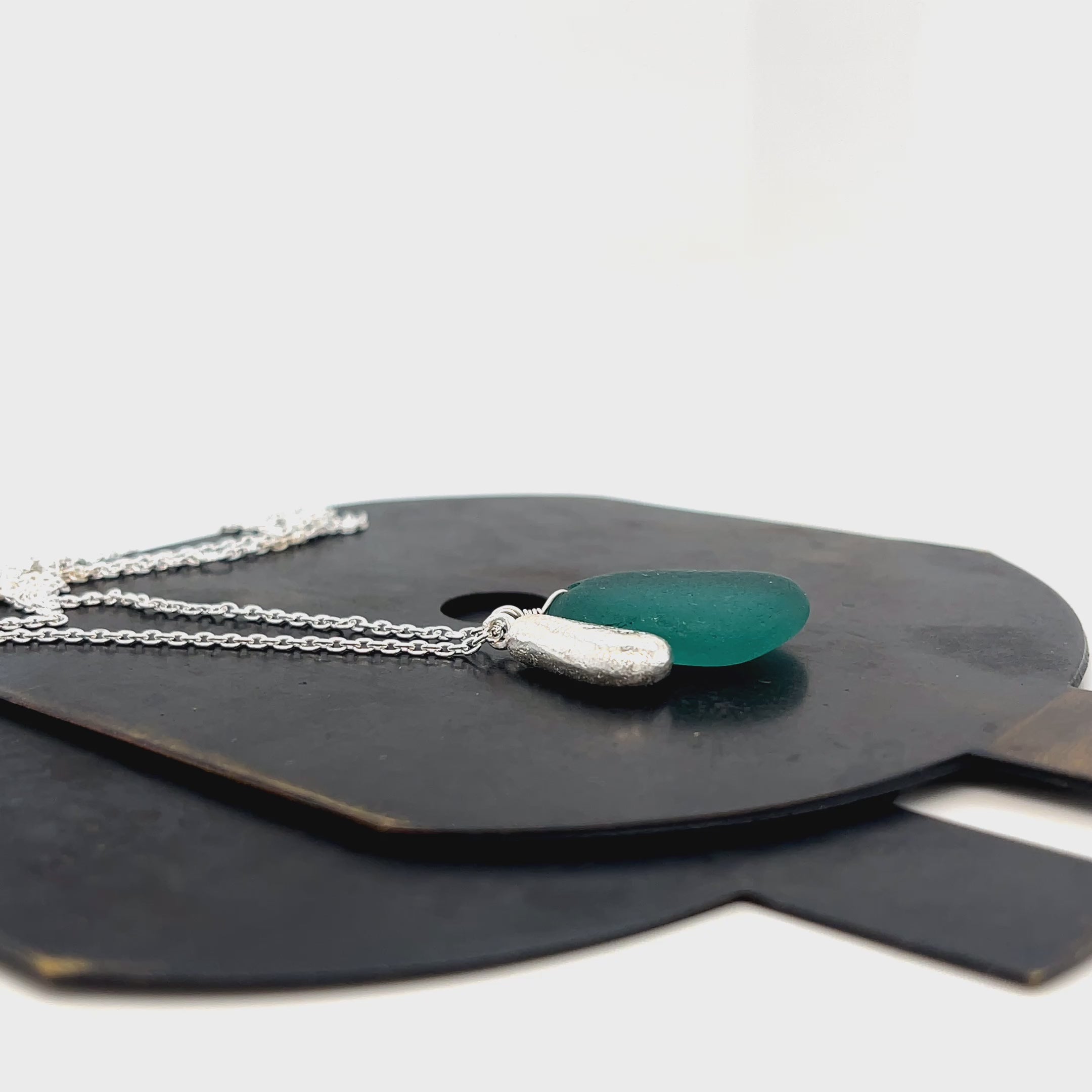 Coastal-inspired teal sea glass and silver jewellery by Kriket Broadhurst