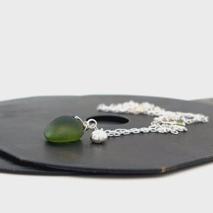 Handcrafted sterling silver sea glass necklace on white background