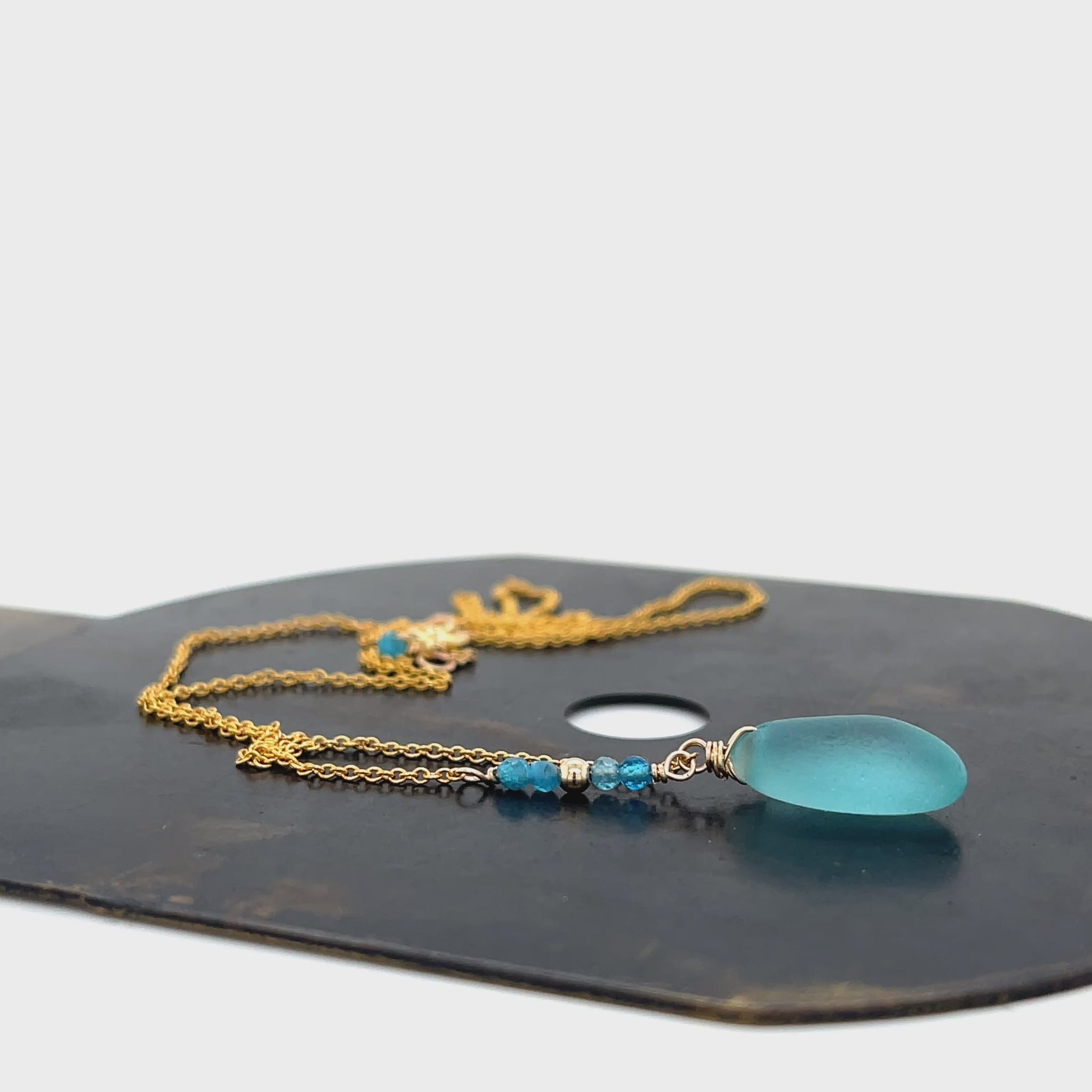 Blue appatite stone accents on gold chain necklace