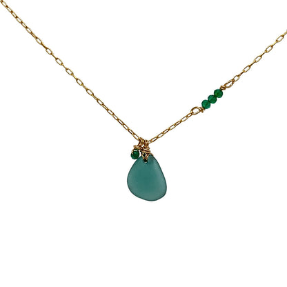 Close-up of gold wire-wrapped sea glass and onyx beads