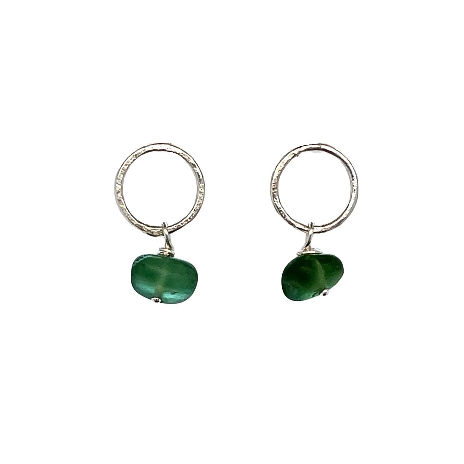 Tiny green sea glass earrings on sterling silver circle studs
