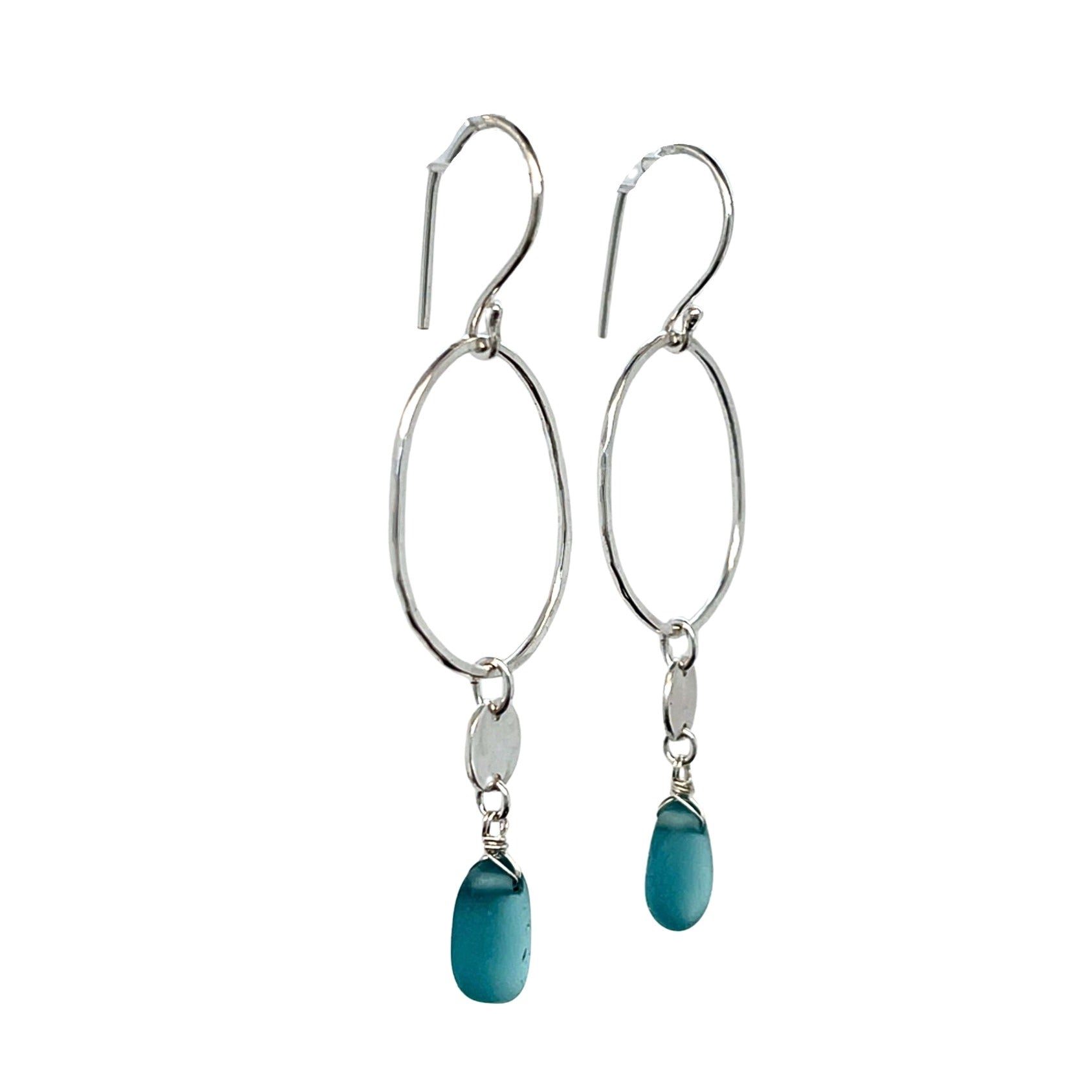 Close-up of turquoise sea glass drops and hammered silver discs