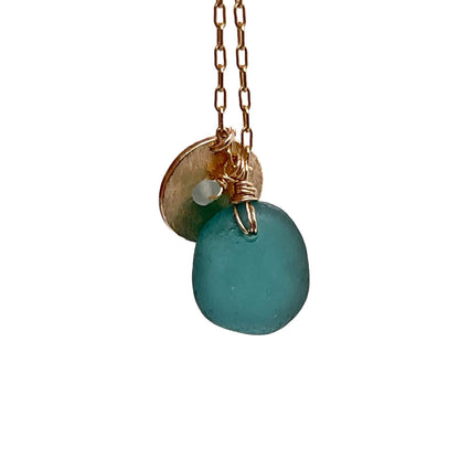 Teal-seaglass-necklace-with-gold-disc-charm-on-gold-chain-kriket-broadhurst-jewellery